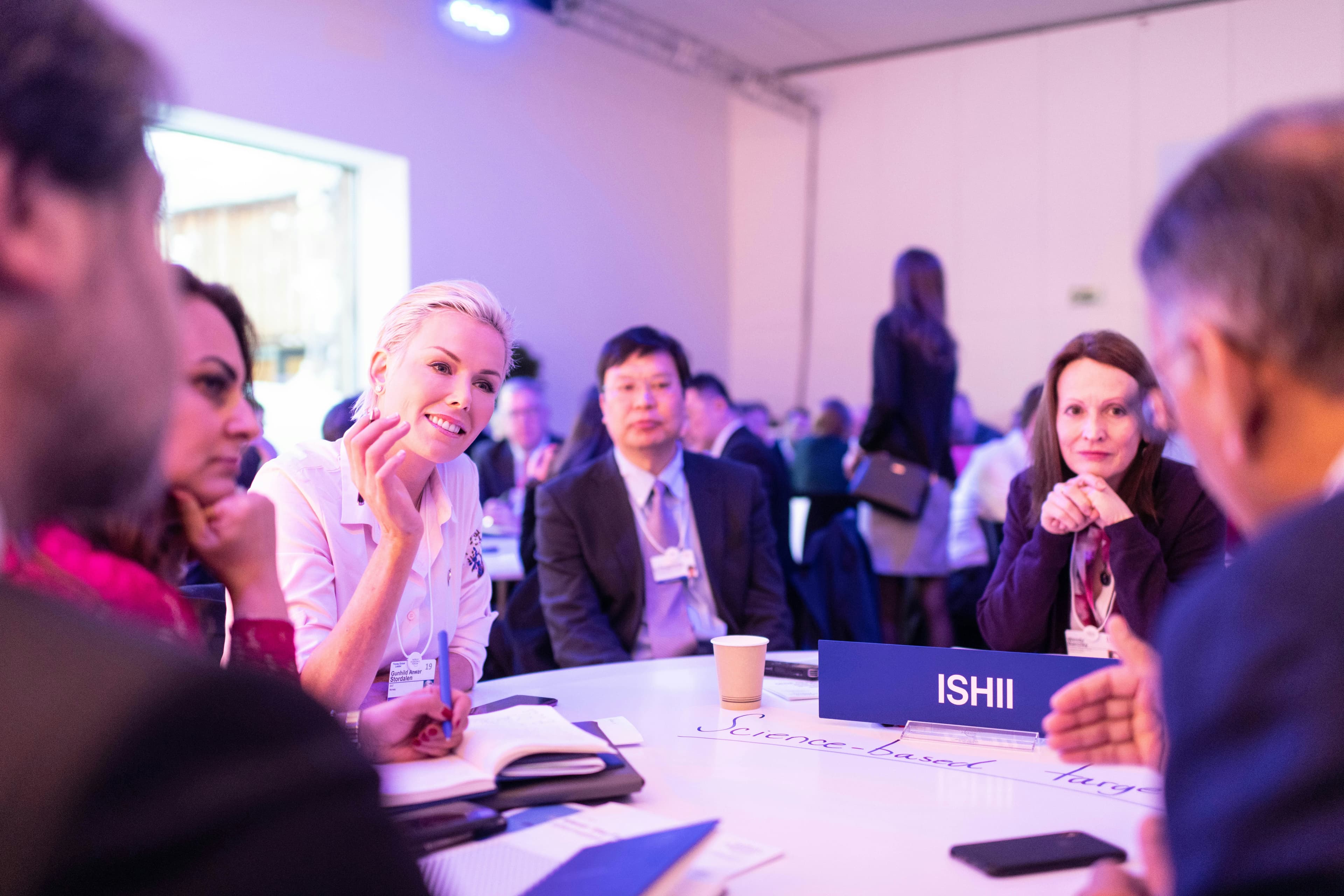 Investigators in discussion at a roundtable session